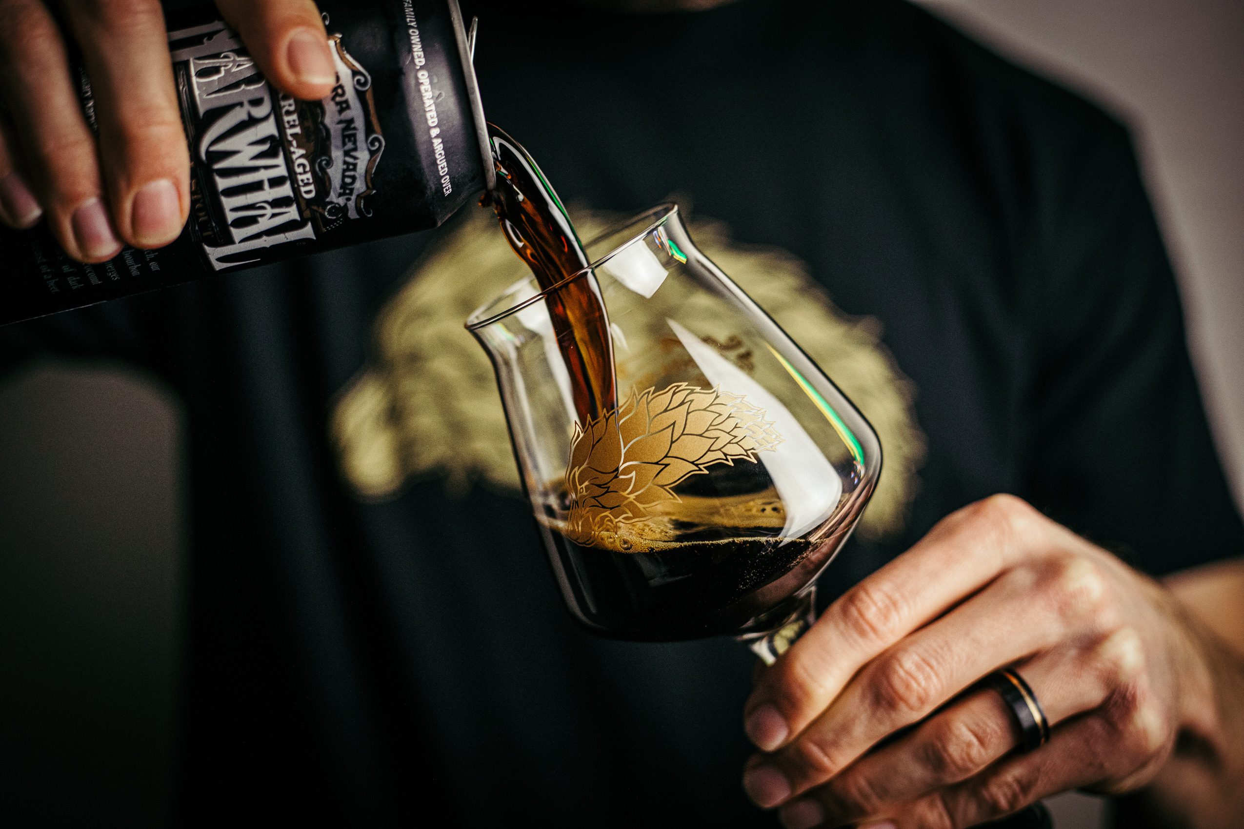 Dark beer pouring into a custom glass for Sierra Nevada's Alpha Hop Society