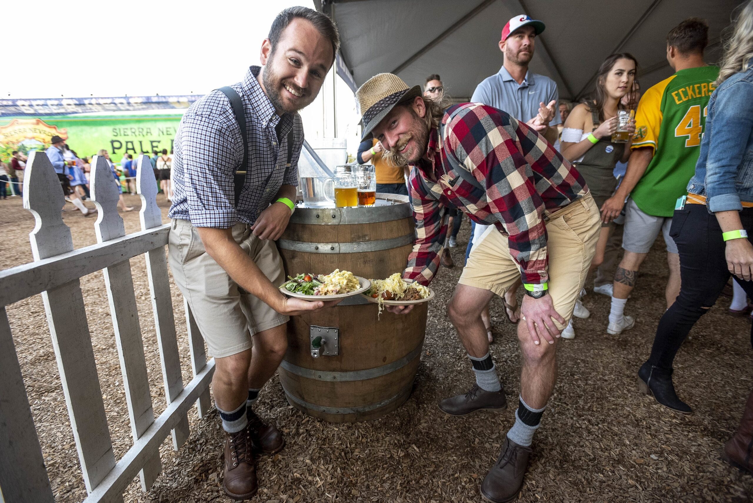 Group of people at Oktoberfest with plates of barrel-aged sauerkraut
