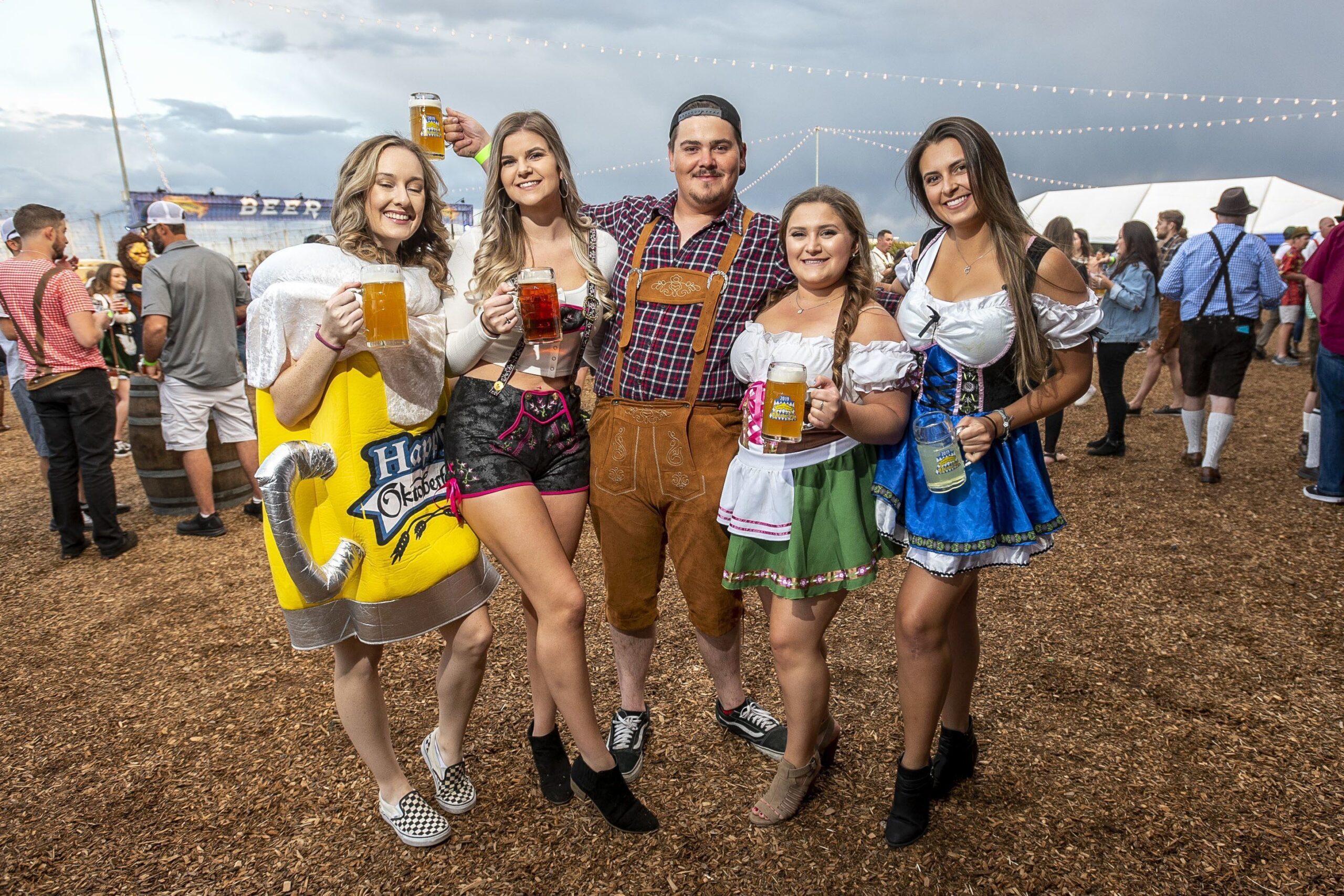 Group of people holding beers at Sierra Nevada Brewing Company's Oktoberfest party
