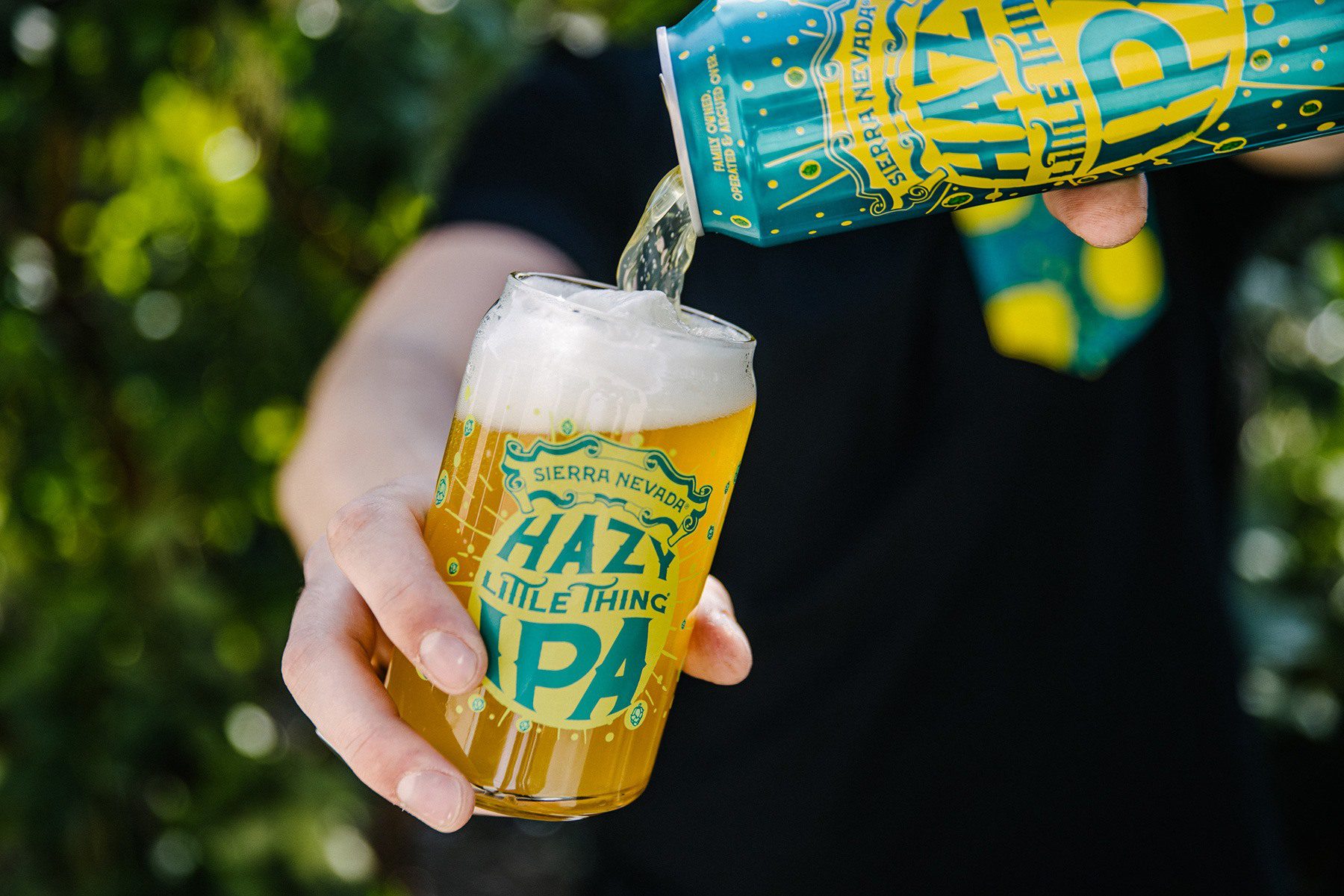 Pouring a can of Sierra Nevada Hazy Little Thing IPA into a custom Hazy Little Thing glass.