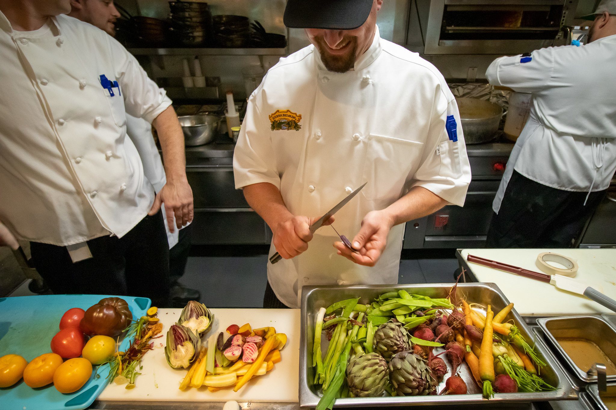 Sierra Nevada Brewing Company chef cutting vegetables in kitchen