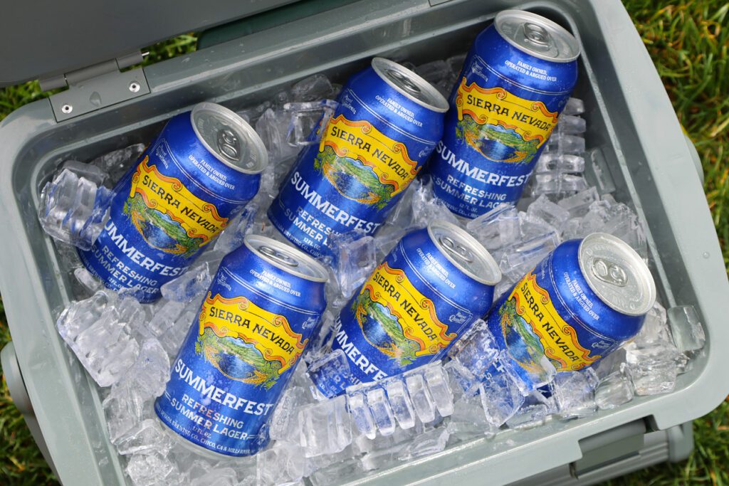 Cans of Summerfest beer in an ice-filled cooler
