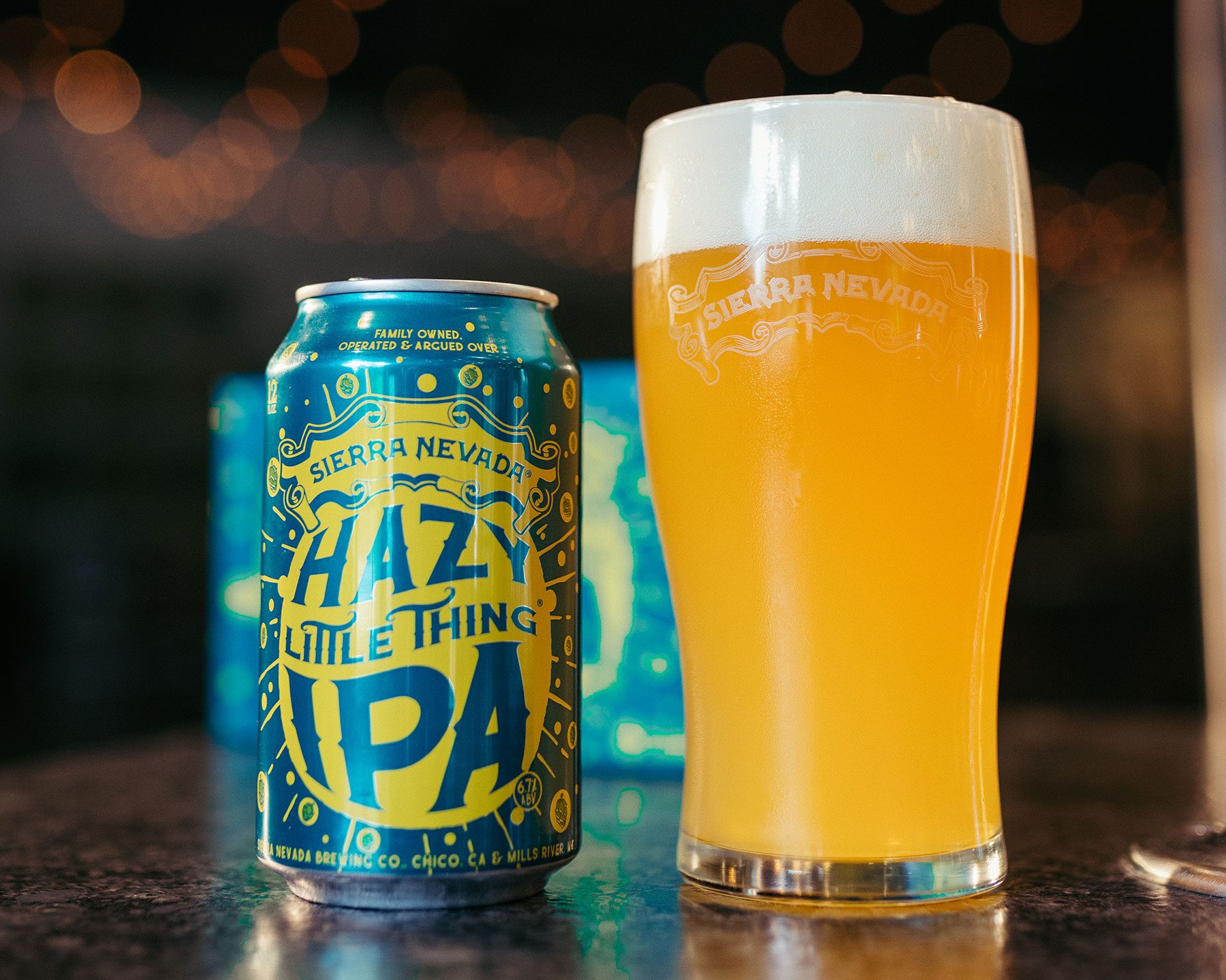 A can of Hazy Little Thing IPA next to a full pint glass