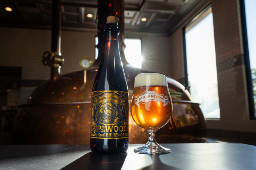 Friends of the Family Bière de Garde bottle and glass in brewhouse