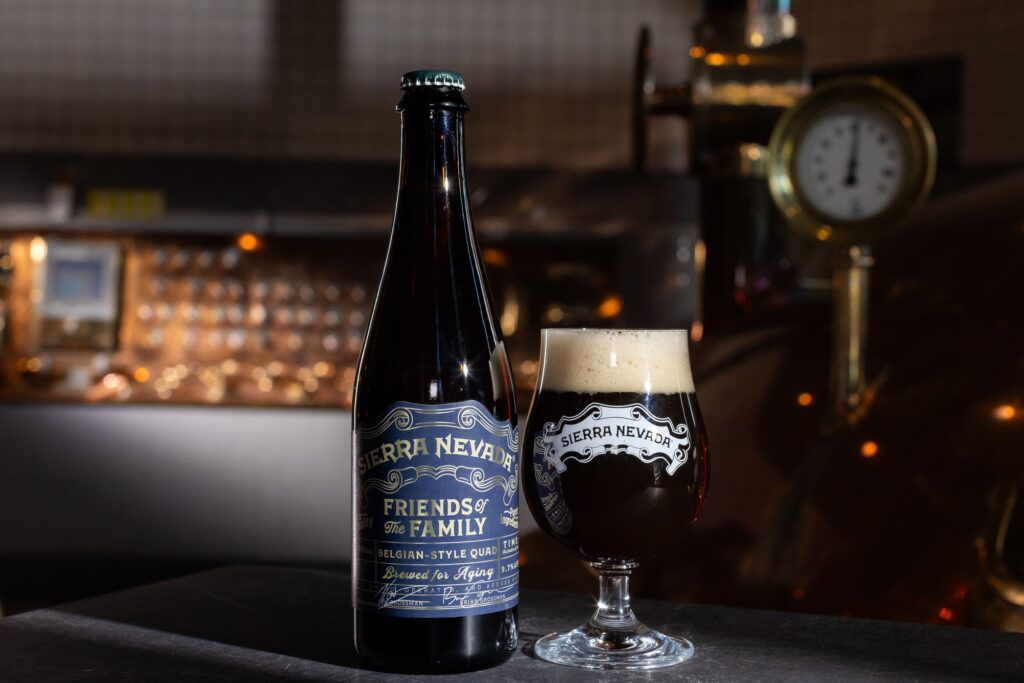 Friends of the Family Belgian Quad bottle and glass in brewhouse
