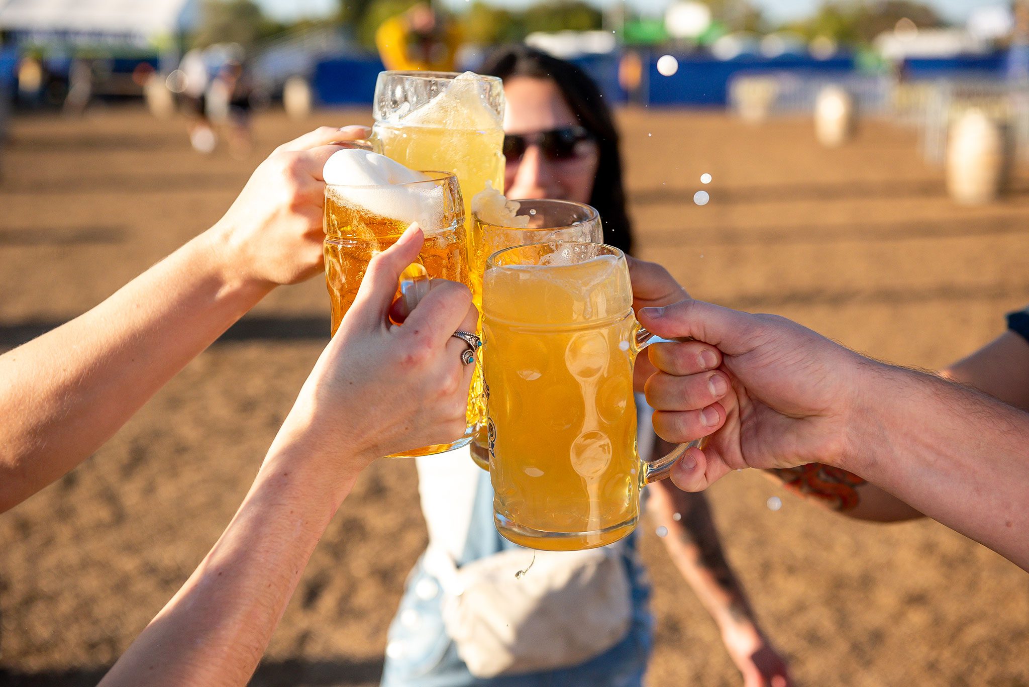 Four friends cheersing Oktoberfest beer steins